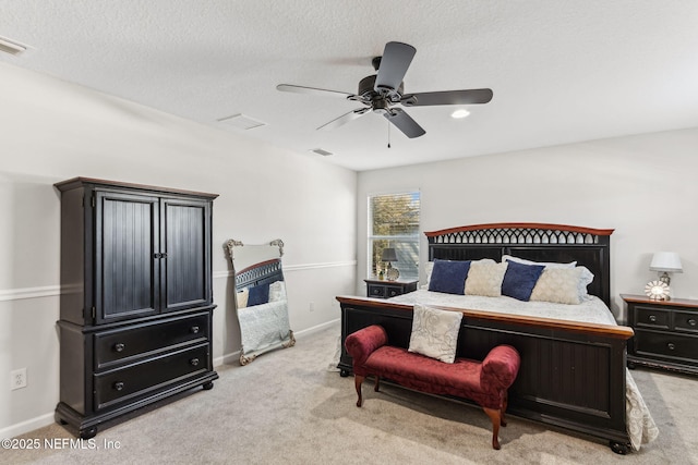 bedroom with light colored carpet, visible vents, ceiling fan, and baseboards