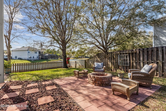 view of patio / terrace featuring an outdoor fire pit and fence private yard