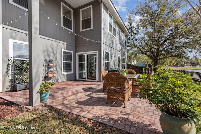 view of patio / terrace featuring fence