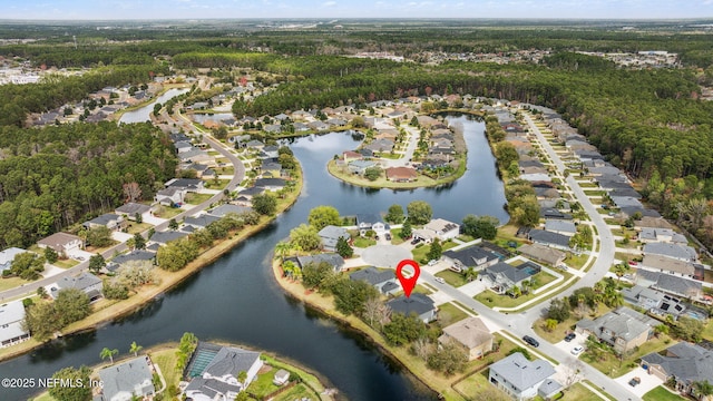 birds eye view of property with a water view and a residential view