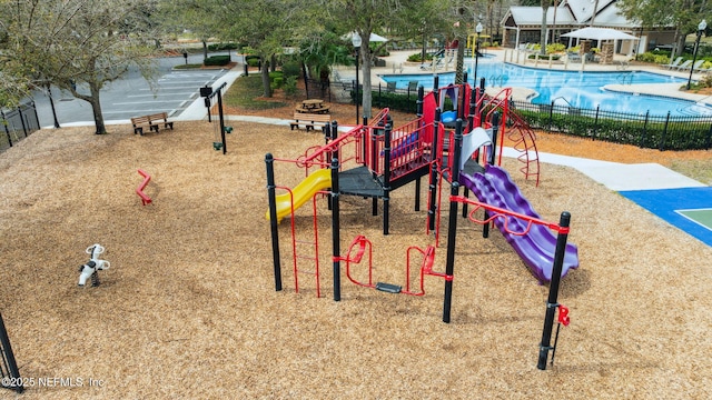 community jungle gym with fence