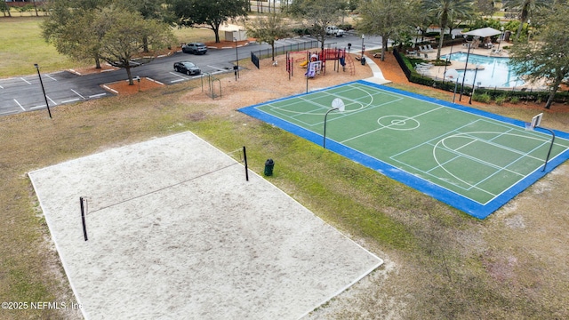 view of property's community featuring playground community and community basketball court