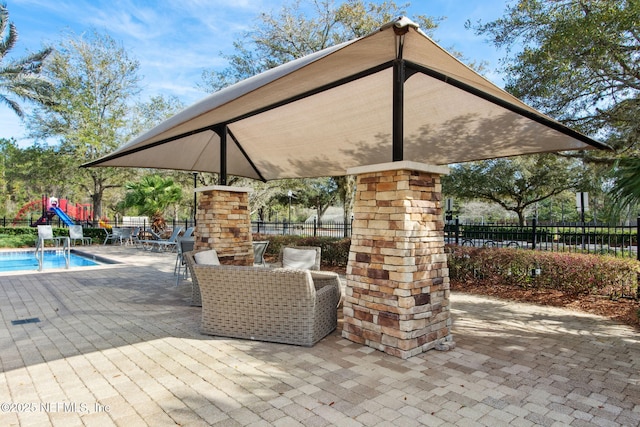 view of patio / terrace featuring fence and a fenced in pool