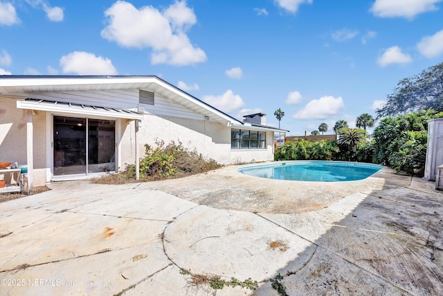 pool featuring a patio