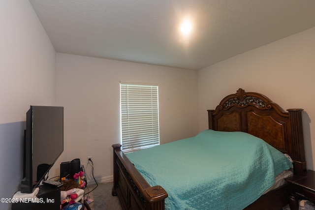 bedroom with baseboards and carpet flooring