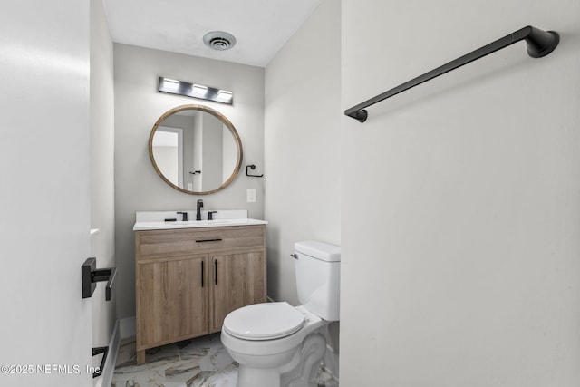 bathroom with marble finish floor, visible vents, vanity, and toilet