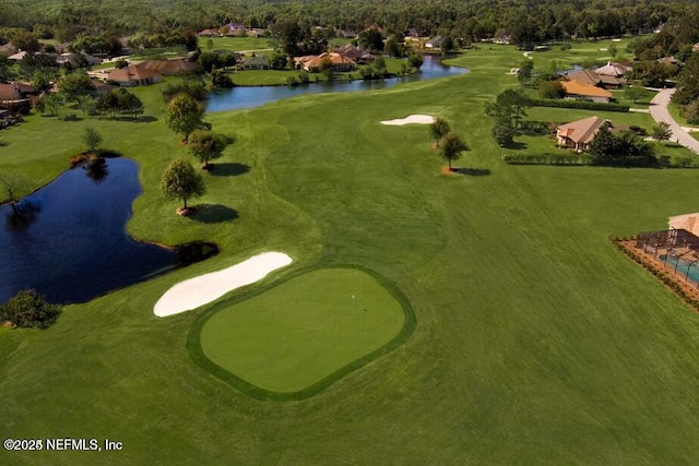 birds eye view of property featuring a water view, golf course view, and a residential view