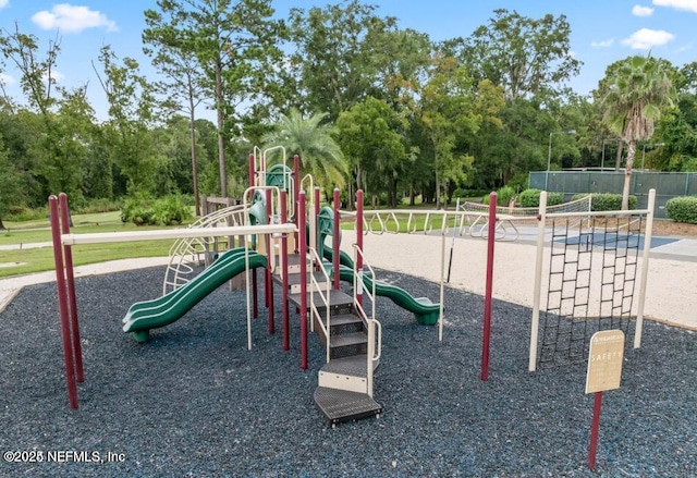community jungle gym featuring fence