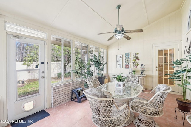 sunroom featuring a ceiling fan and lofted ceiling