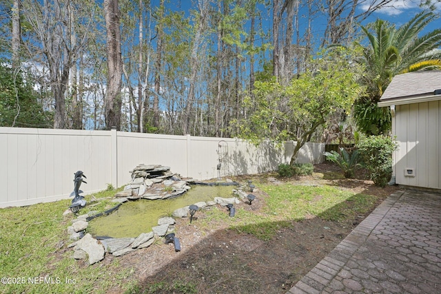 view of yard featuring a fenced backyard