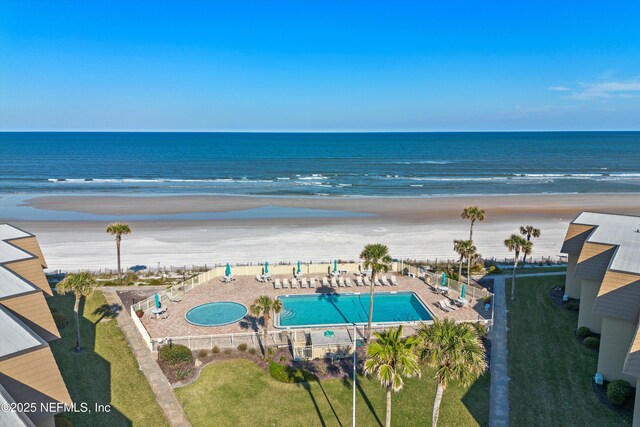 aerial view featuring a water view and a beach view