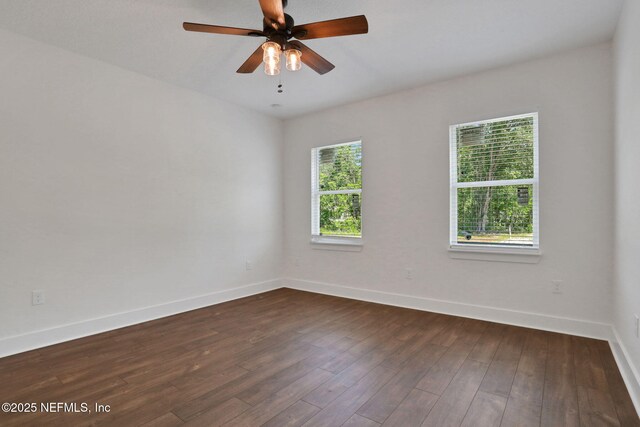 44024 Breezy Ln, Callahan, FL 32011 - spare room with baseboards, dark wood-style floors, and ceiling fan