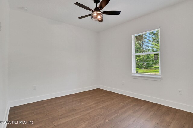 44024 Breezy Ln, Callahan, FL 32011 - empty room featuring baseboards, dark wood-style flooring, and a ceiling fan