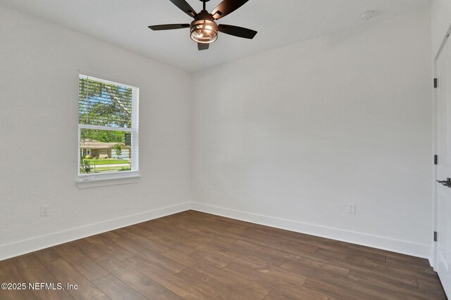 44024 Breezy Ln, Callahan, FL 32011 - empty room with dark wood-type flooring, baseboards, and ceiling fan