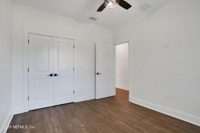 44024 Breezy Ln, Callahan, FL 32011 - unfurnished bedroom featuring wood finished floors, baseboards, a closet, and ceiling fan