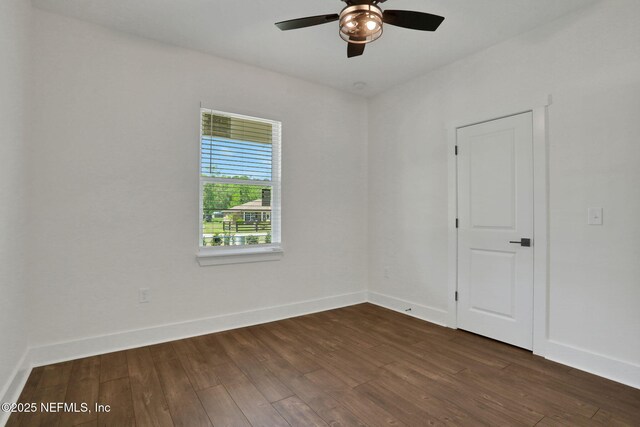 44024 Breezy Ln, Callahan, FL 32011 - unfurnished room featuring dark wood-type flooring, ceiling fan, and baseboards