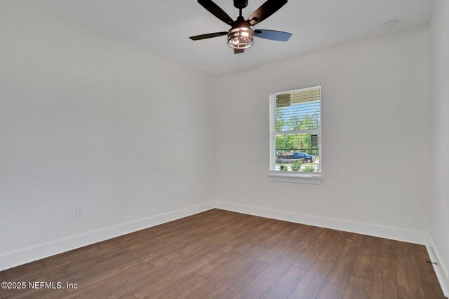 44024 Breezy Ln, Callahan, FL 32011 - empty room with baseboards, dark wood finished floors, and a ceiling fan