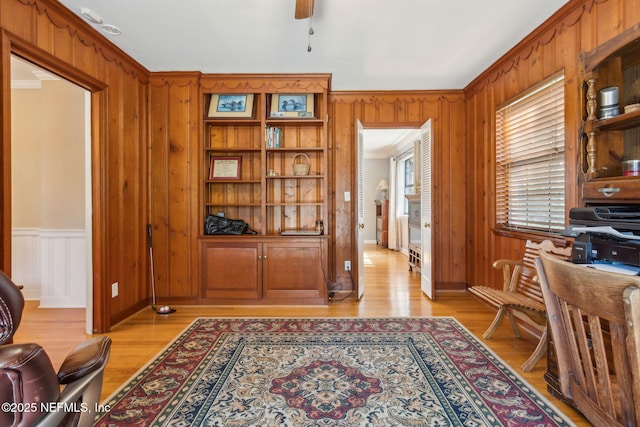 home office featuring a ceiling fan and light wood finished floors