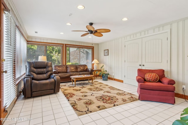 living area featuring light tile patterned floors, visible vents, recessed lighting, ceiling fan, and ornamental molding