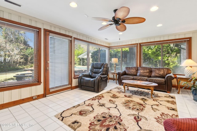 living room with light tile patterned floors, visible vents, ceiling fan, and recessed lighting