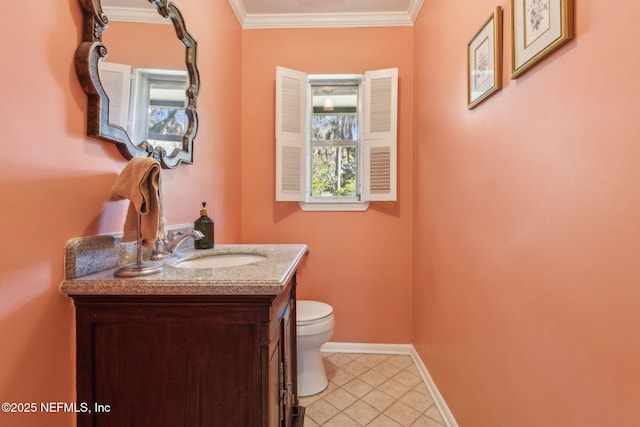 half bathroom featuring tile patterned flooring, crown molding, baseboards, toilet, and vanity