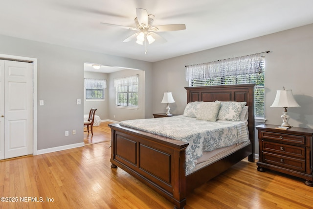 bedroom featuring light wood finished floors, ceiling fan, and baseboards