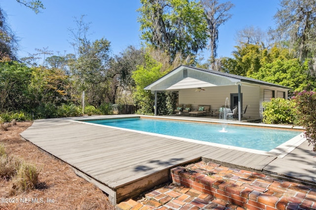 outdoor pool with a ceiling fan