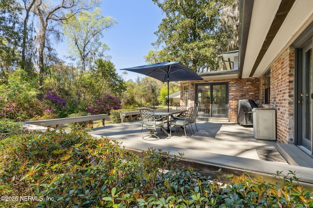 view of patio featuring a grill and outdoor dining space