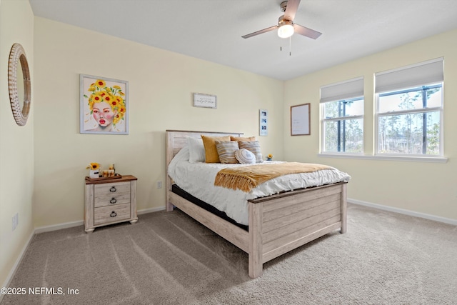 bedroom with ceiling fan, carpet floors, and baseboards