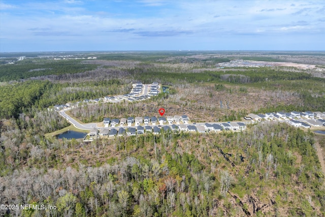 bird's eye view with a water view and a wooded view