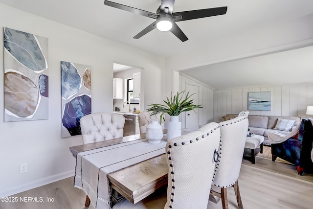 dining room with light wood-style floors and ceiling fan