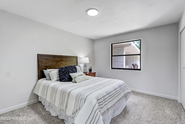 carpeted bedroom with baseboards