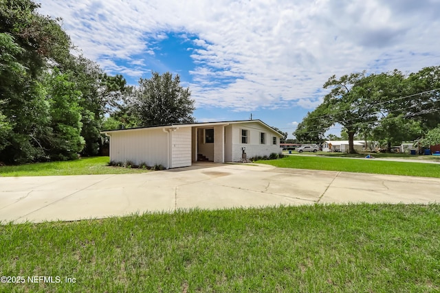 view of outbuilding featuring driveway