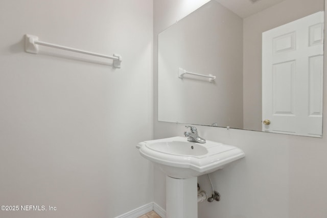 bathroom with baseboards