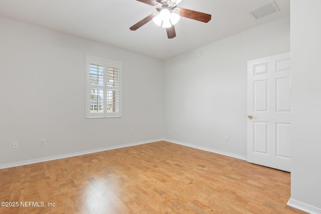 unfurnished room with light wood-type flooring, baseboards, visible vents, and ceiling fan