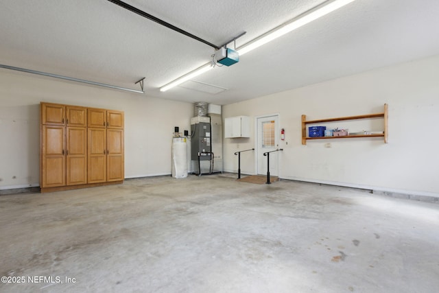 garage featuring heating unit and a garage door opener