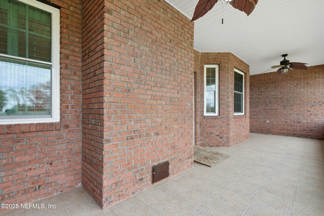 view of patio featuring ceiling fan