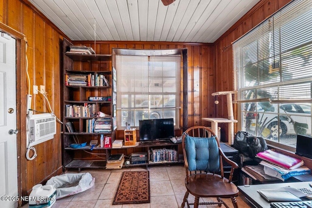 office space featuring a healthy amount of sunlight and wood walls