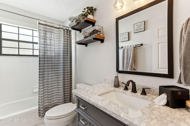 bathroom with shower / bath combination with curtain, a textured ceiling, toilet, and vanity