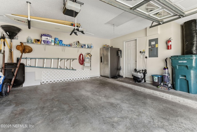 garage with electric panel, a garage door opener, and stainless steel fridge