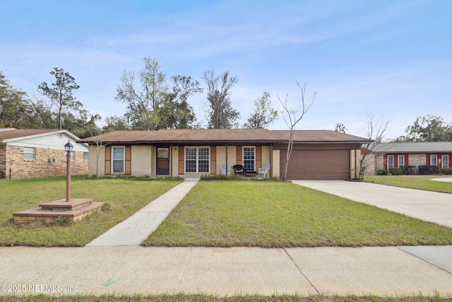 ranch-style house featuring concrete driveway, brick siding, an attached garage, and a front lawn