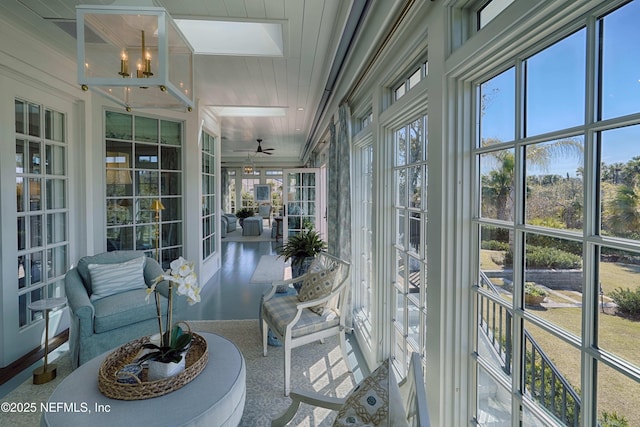 sunroom / solarium featuring a wealth of natural light and ceiling fan