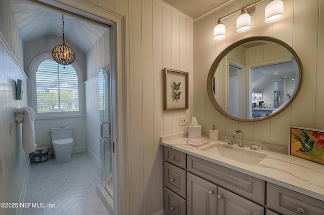 bathroom with vanity, an inviting chandelier, a shower stall, tile patterned floors, and toilet