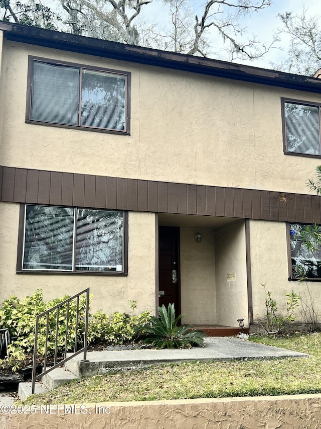 multi unit property featuring stucco siding