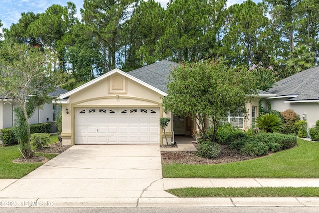 ranch-style house featuring roof with shingles, driveway, an attached garage, and stucco siding