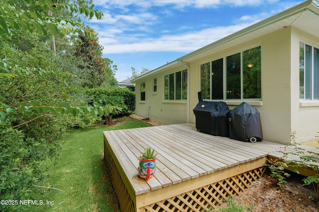 deck featuring a lawn