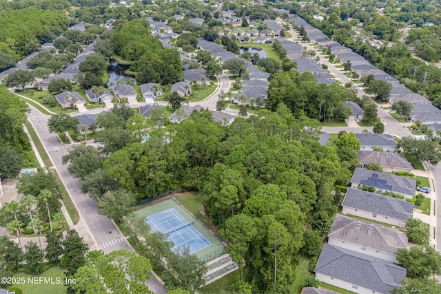 birds eye view of property with a residential view