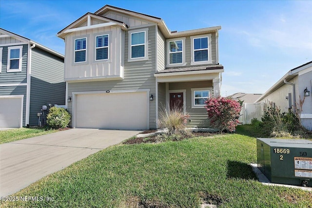 craftsman-style home with driveway, a garage, board and batten siding, and a front yard