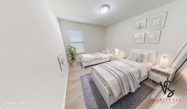 bedroom featuring wood finished floors