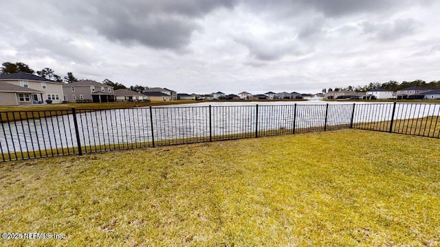 view of yard with fence and a residential view